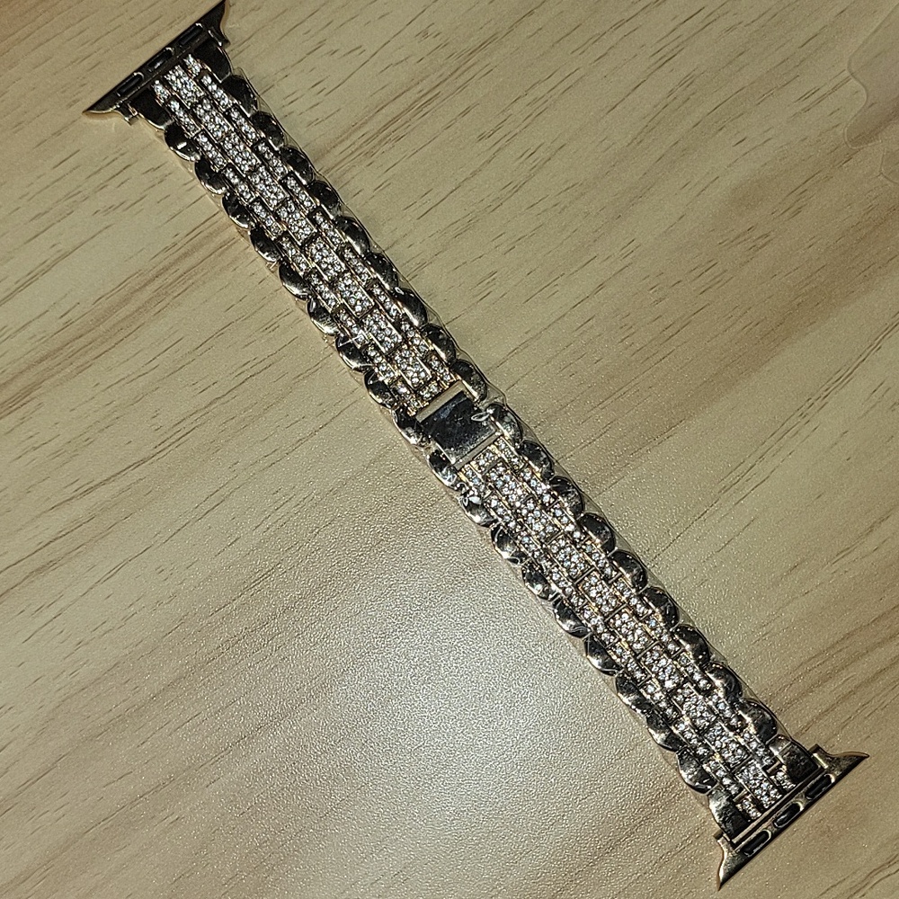 gold toned and sparkly crystal apple watch band